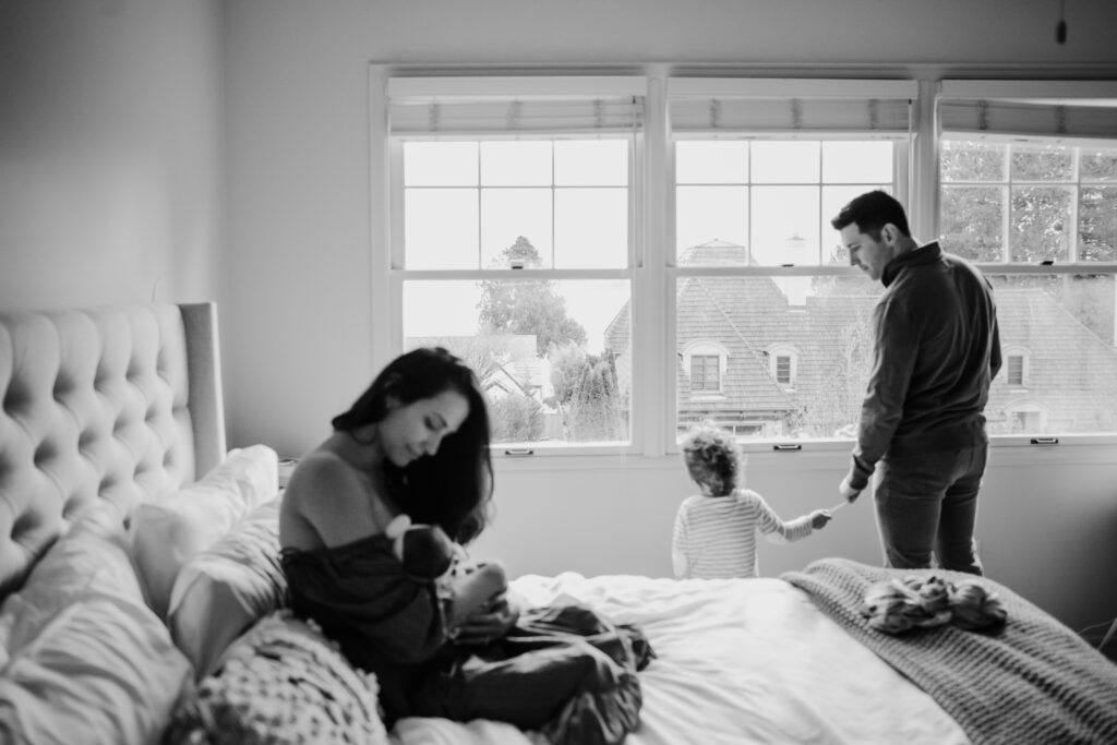 candid lifestyle family bed newborn photo shoot